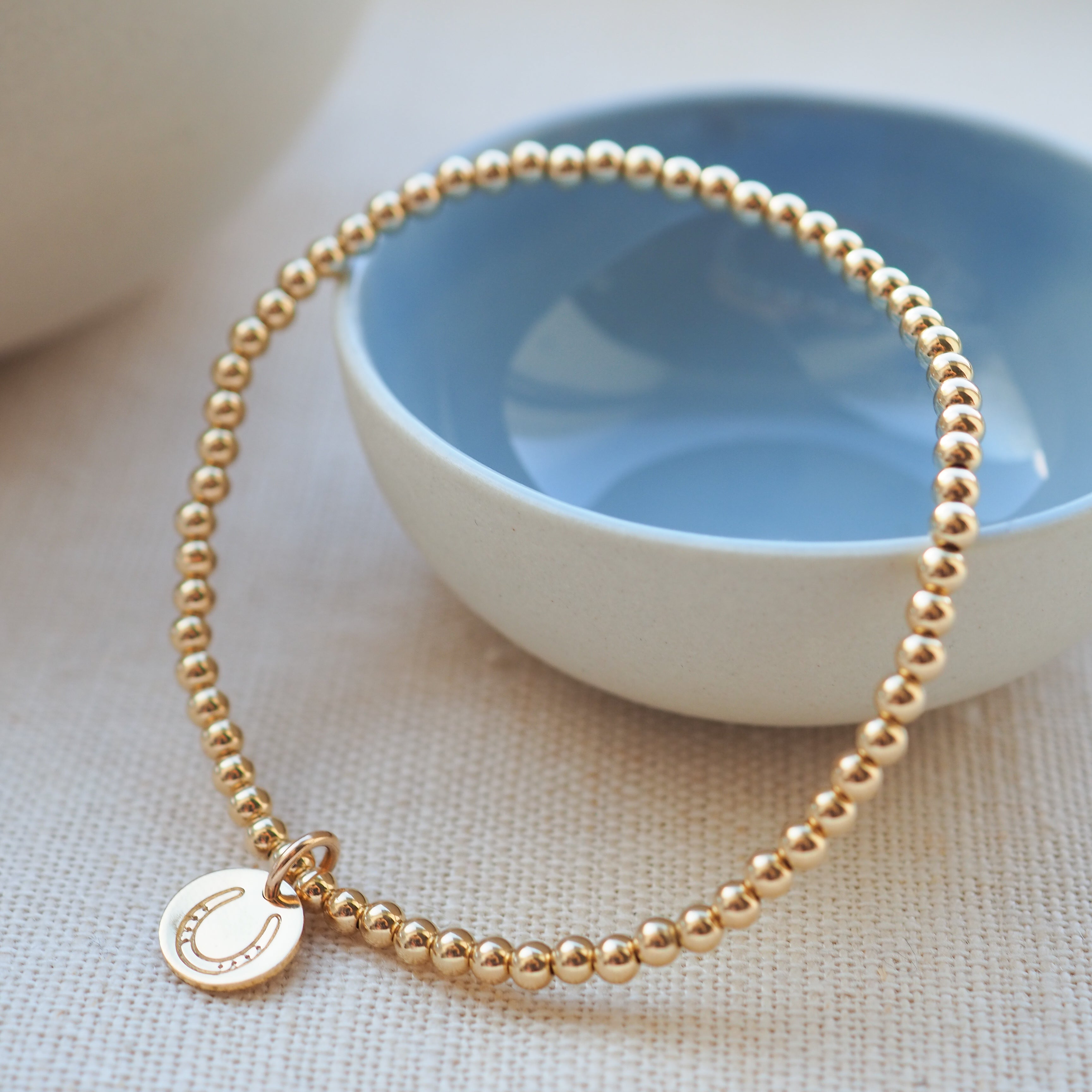 Gold Horseshoe Disc Beaded Bracelet