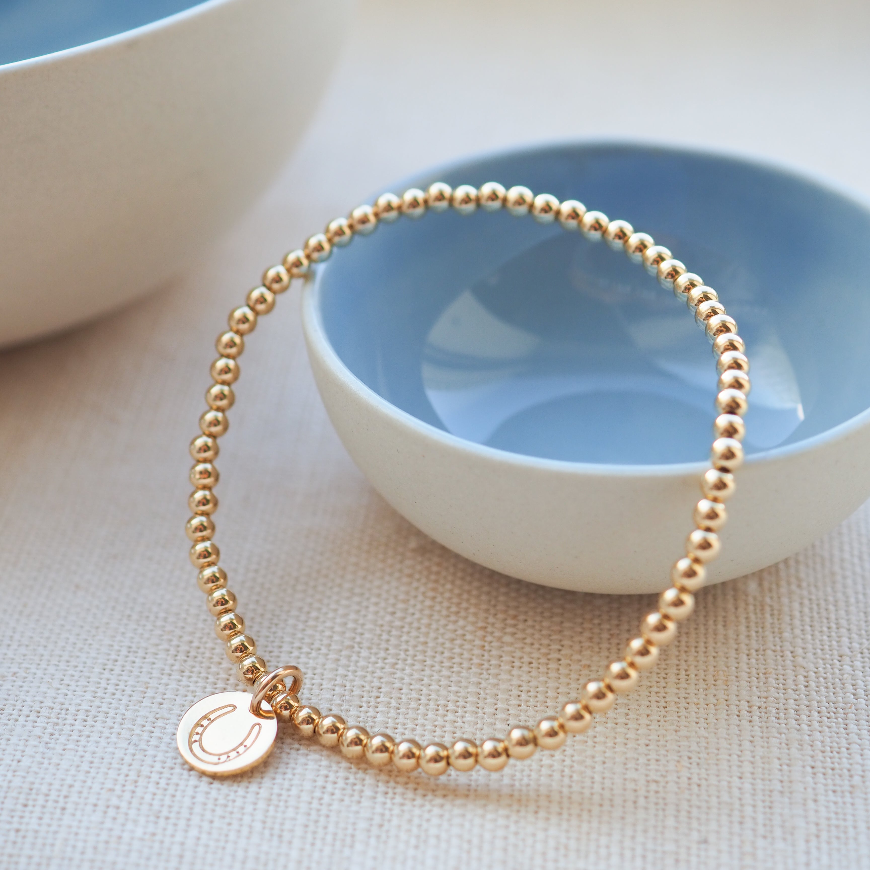 Gold Horseshoe Disc Beaded Bracelet