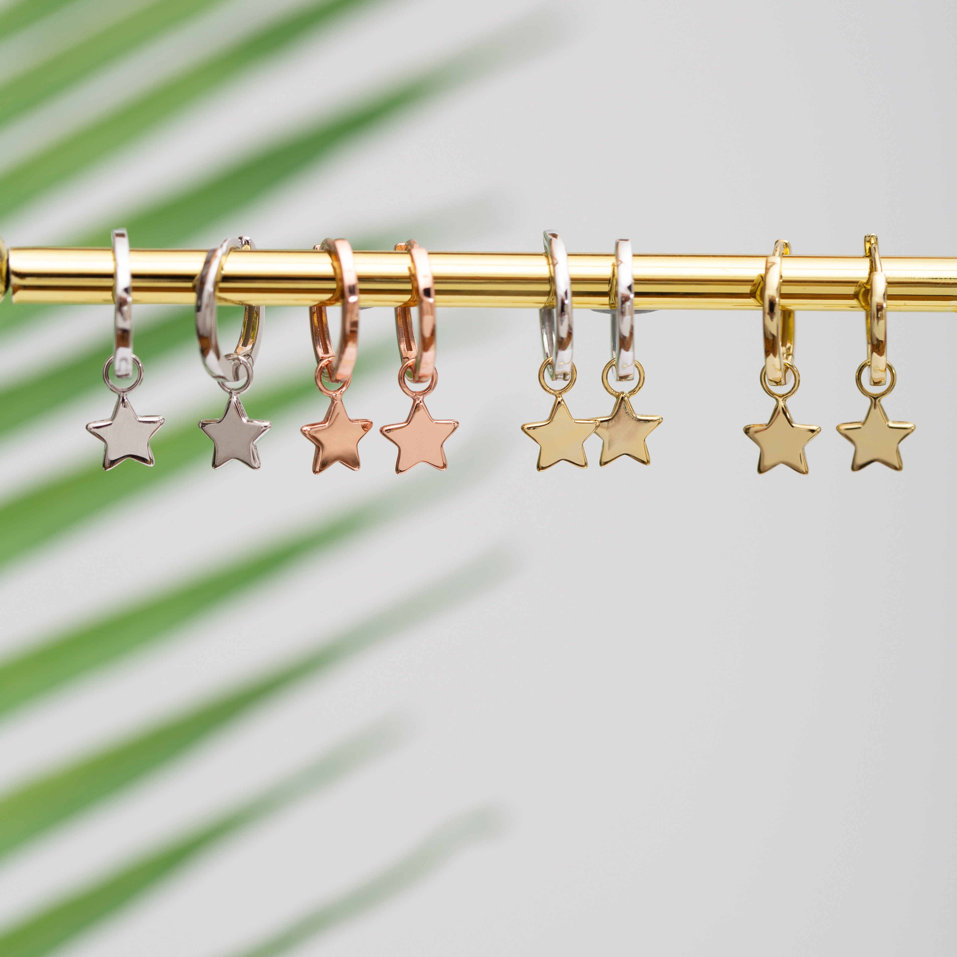 Discontinued - Rose gold star huggies