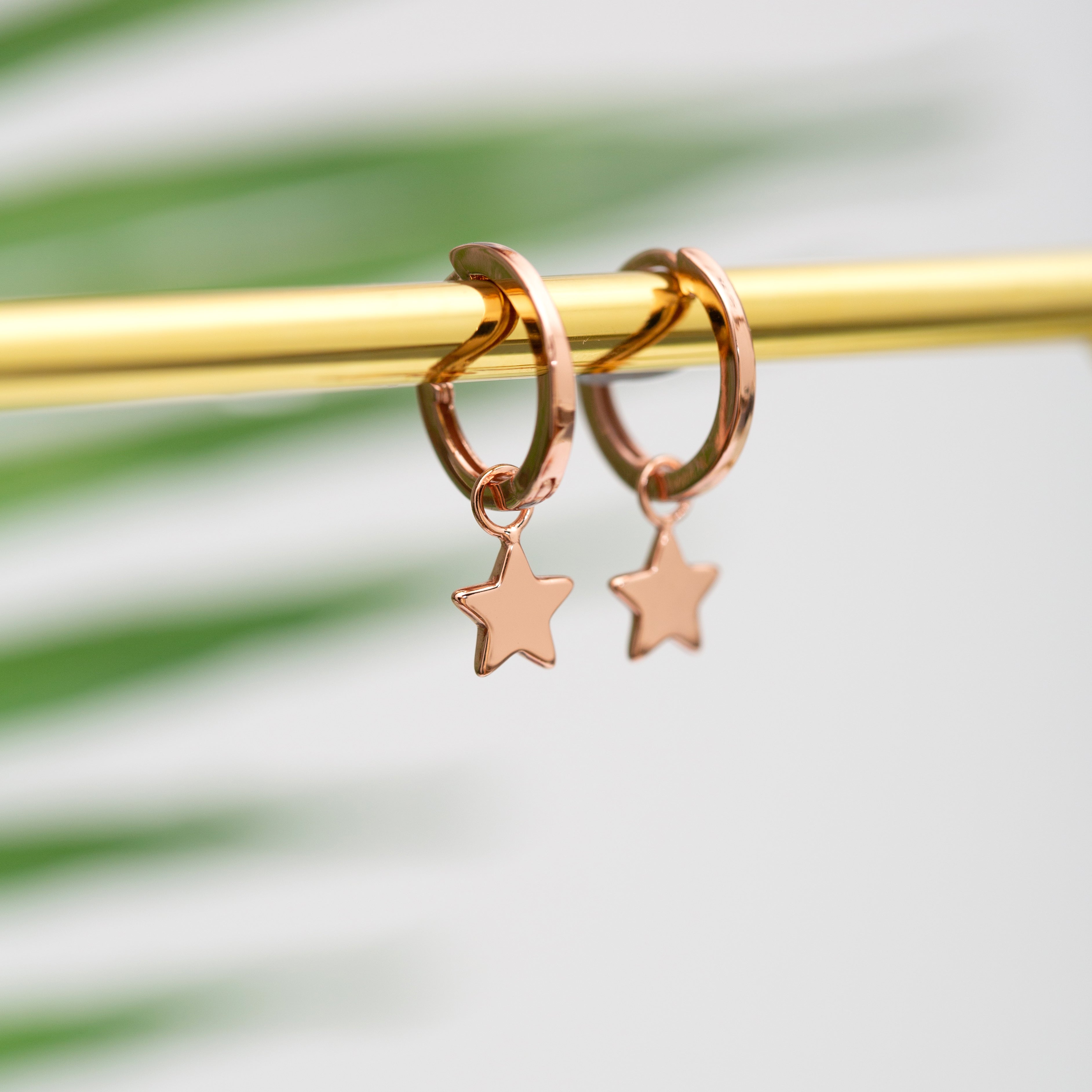 Discontinued - Rose gold star huggies