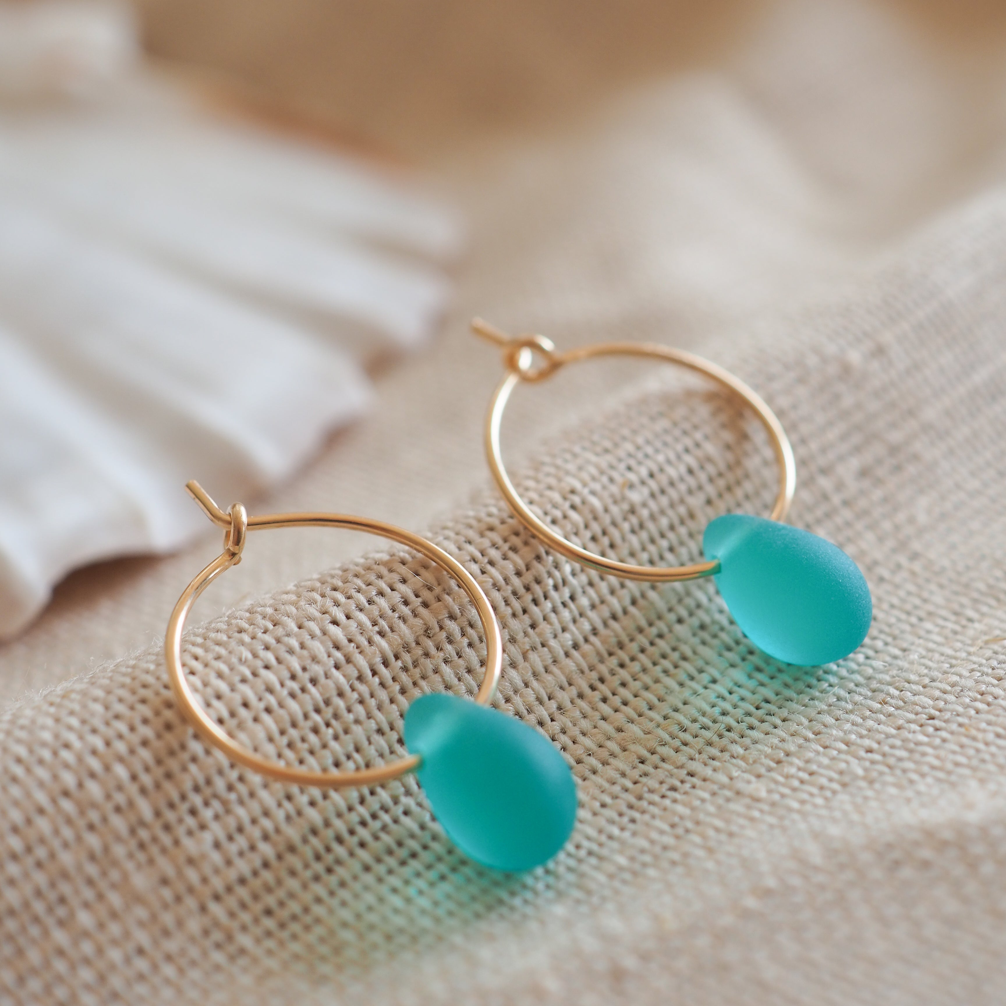 Gold drop of the ocean hoops