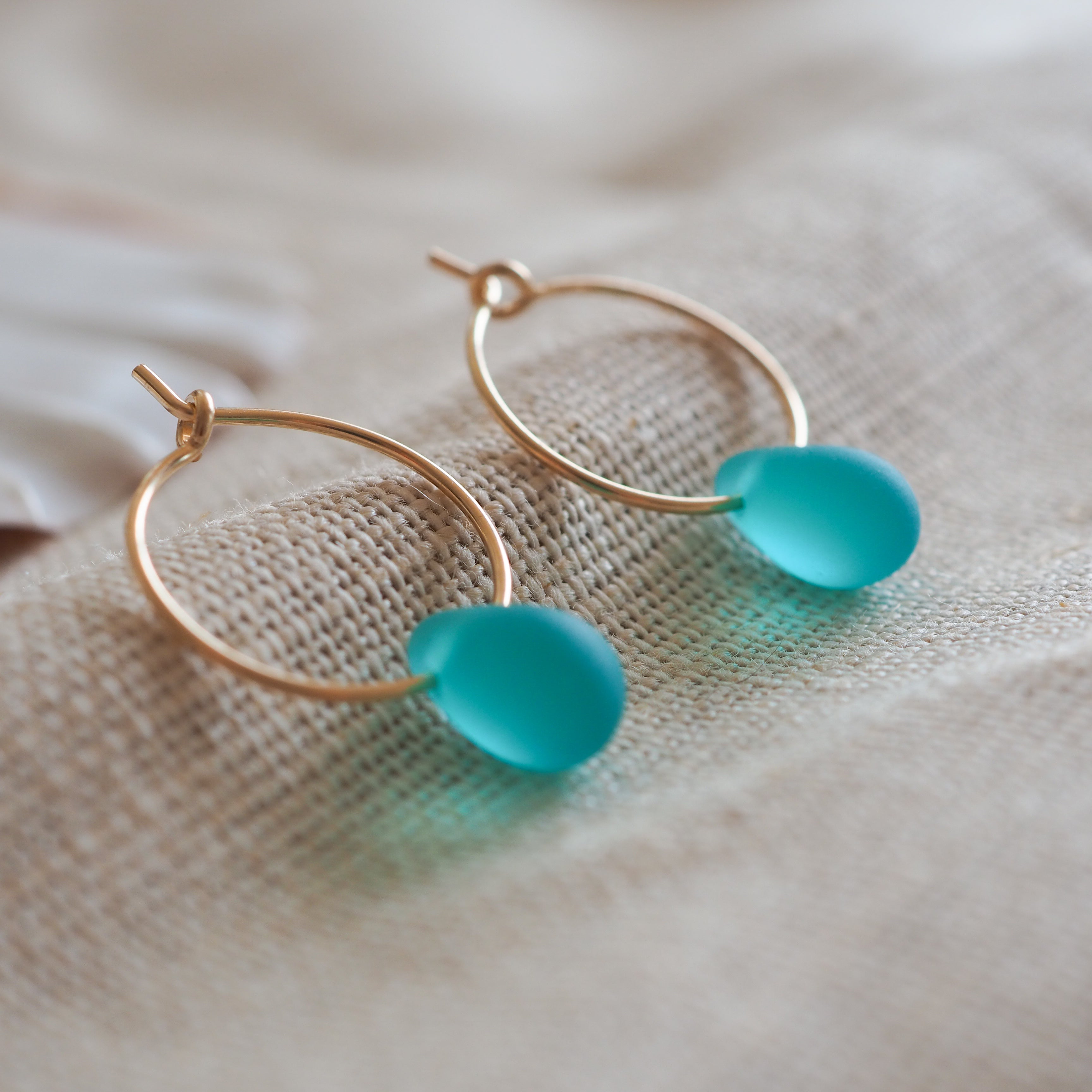 Gold drop of the ocean hoops