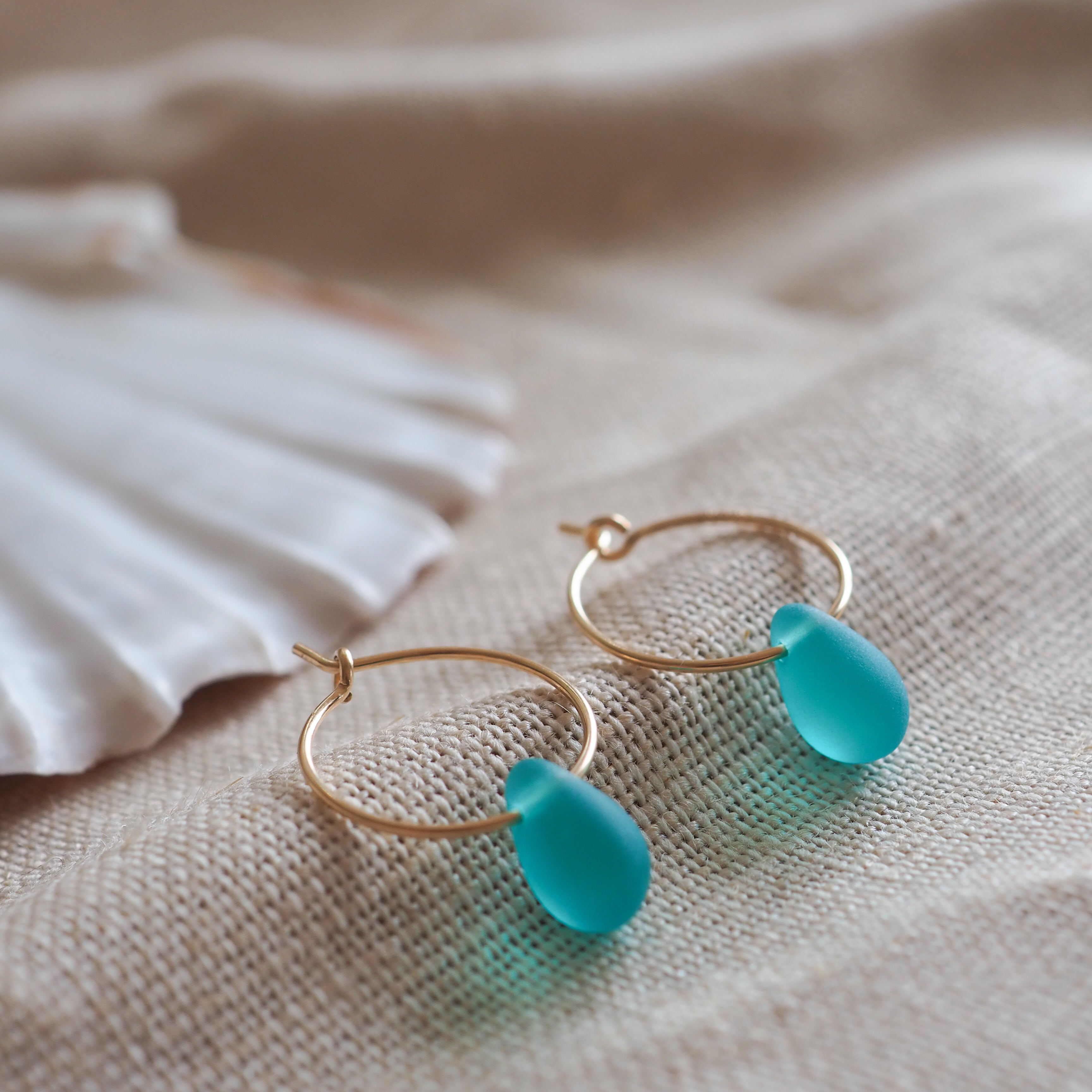 Gold drop of the ocean hoops