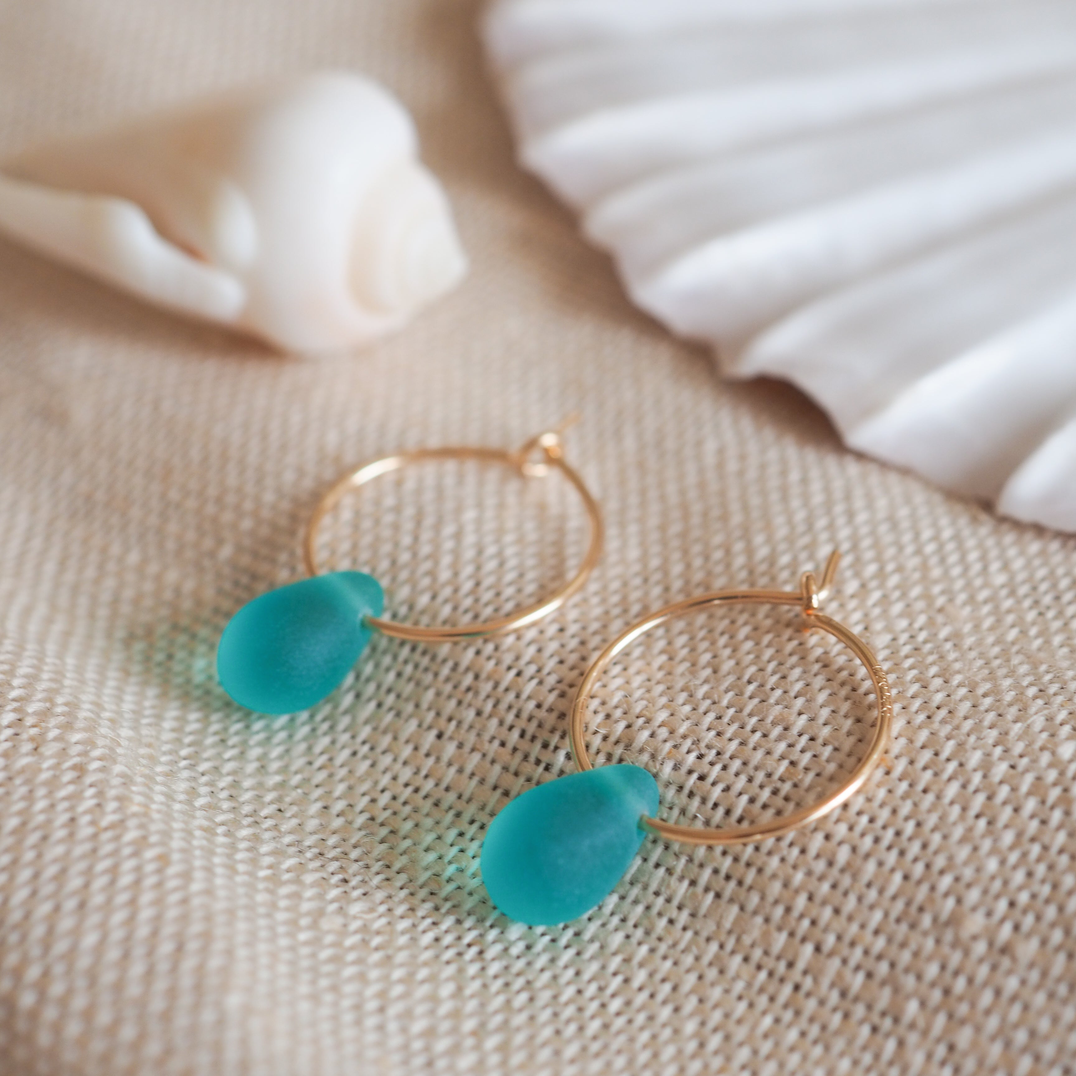 Gold drop of the ocean hoops