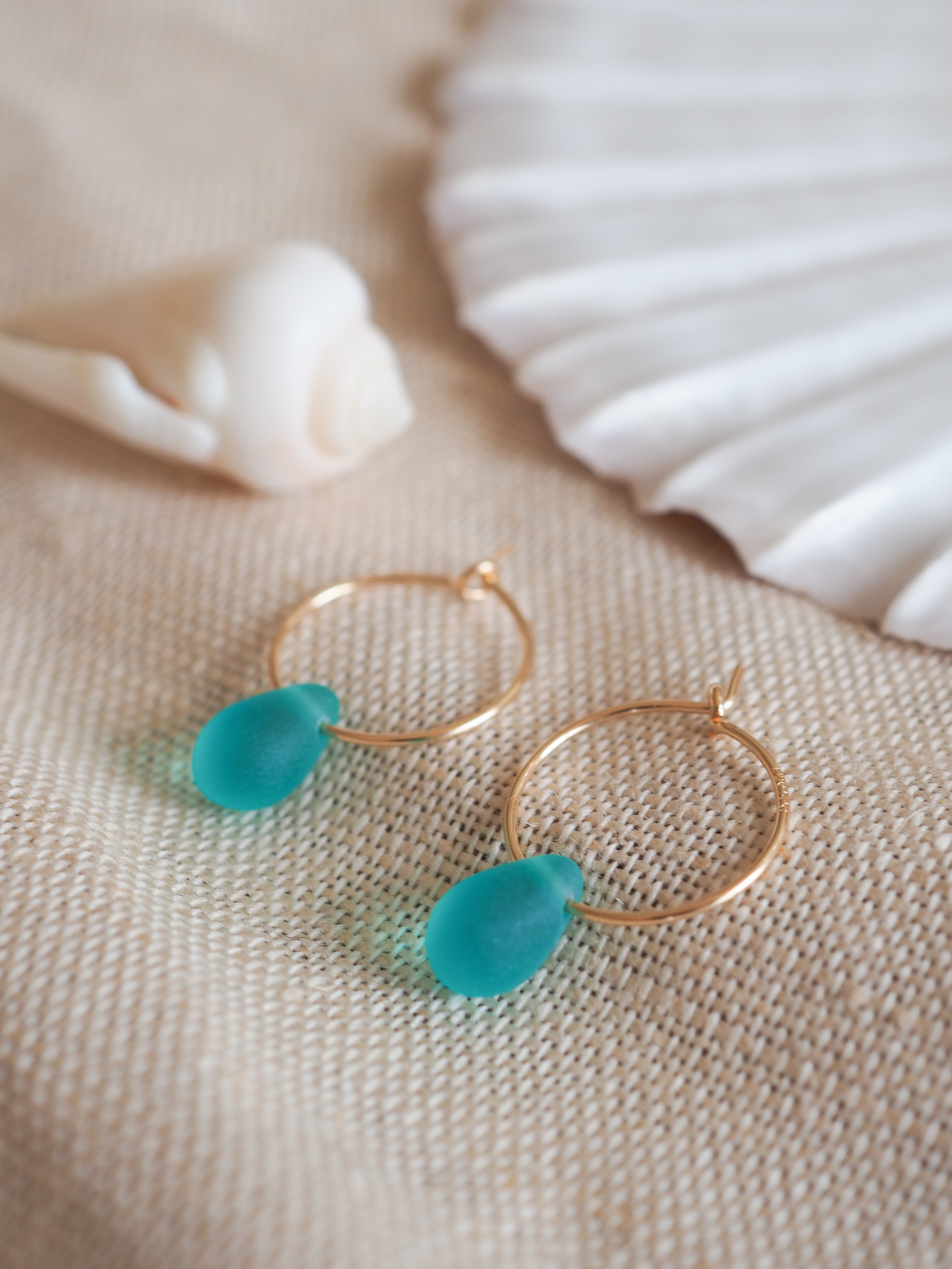 Gold drop of the ocean hoops