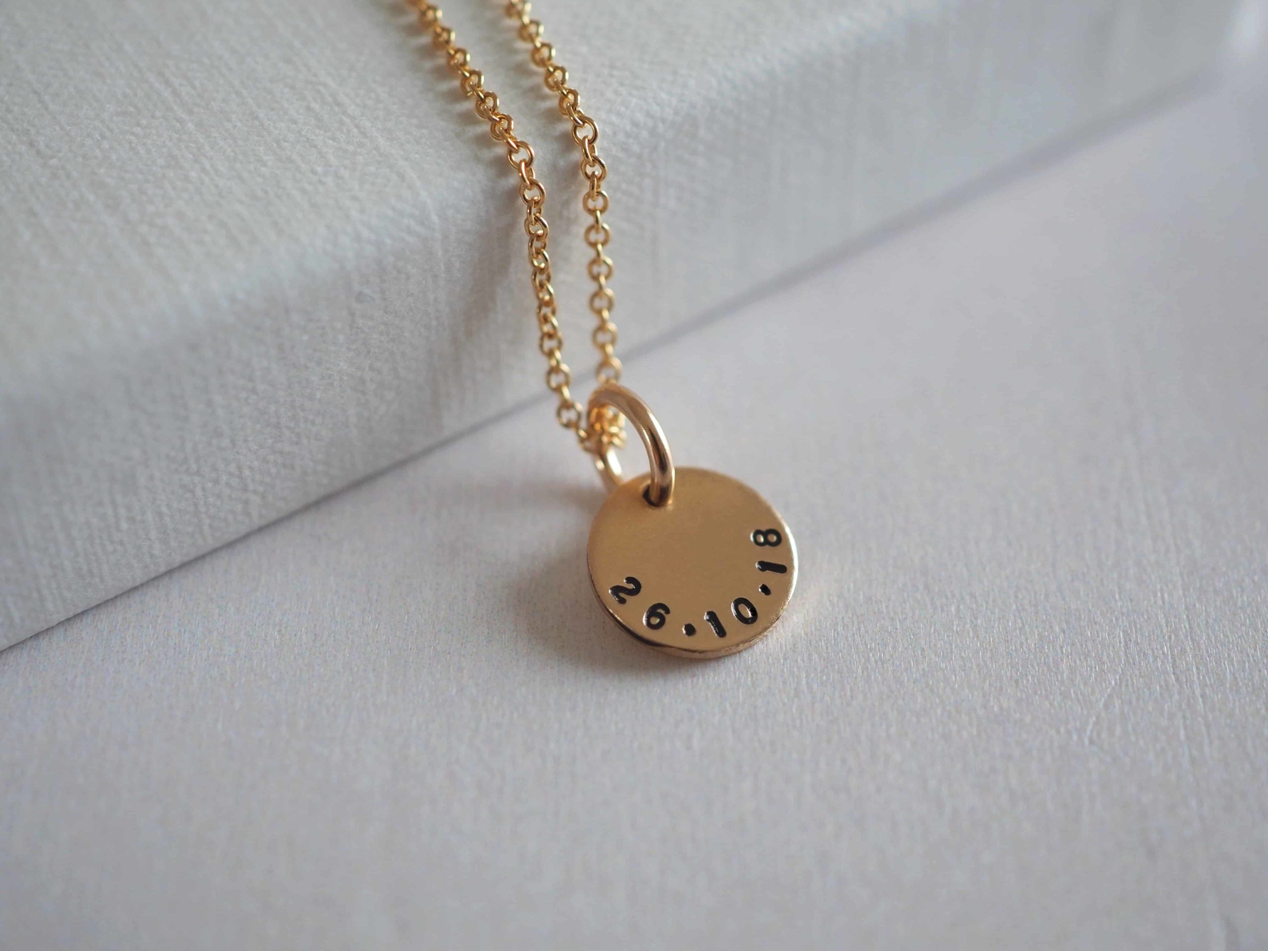 Gold mini disc necklace